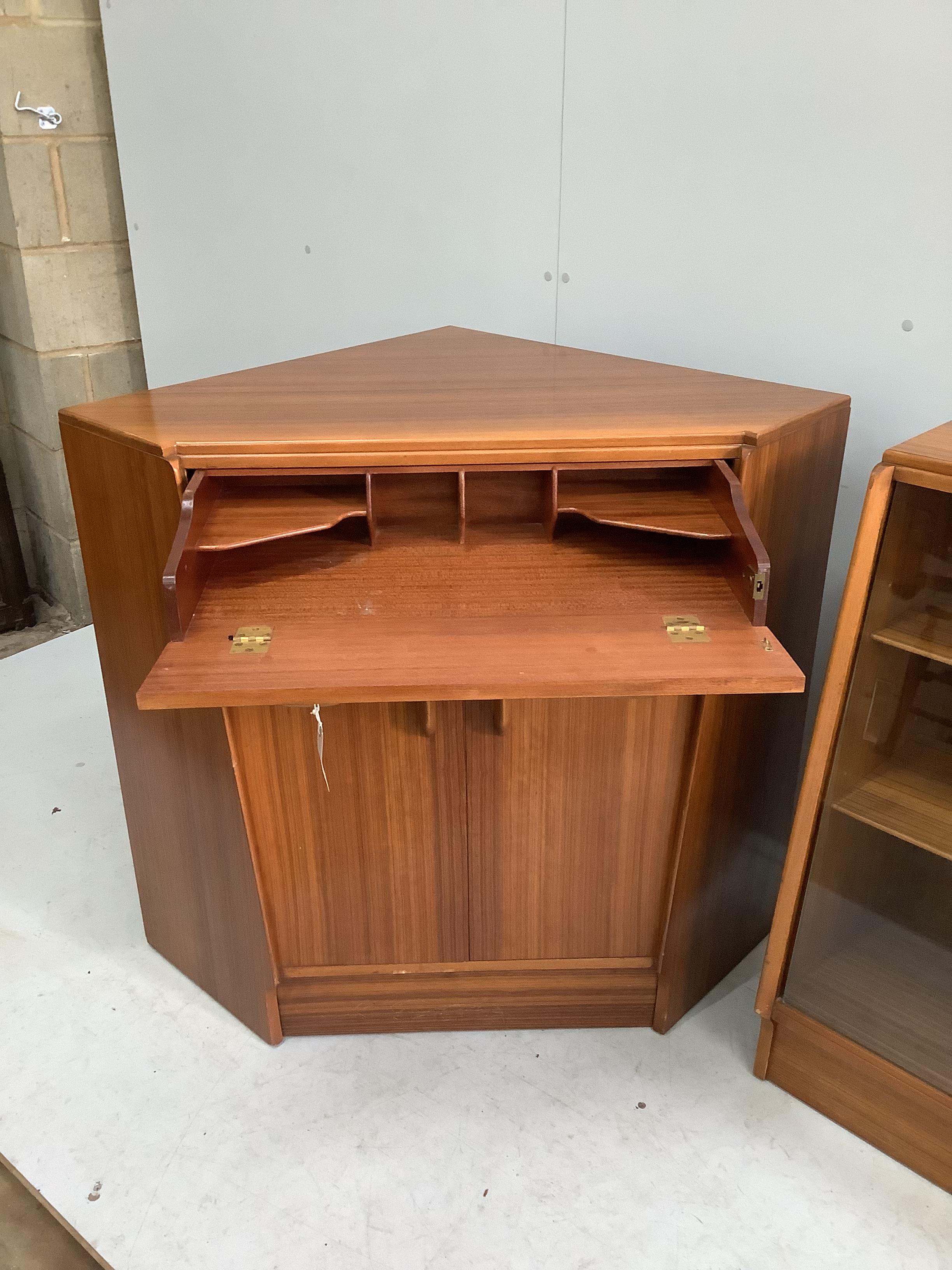 A mid century G-Plan teak corner bureau / combined bookcase, length 161cm, depth 70cm, height 85cm